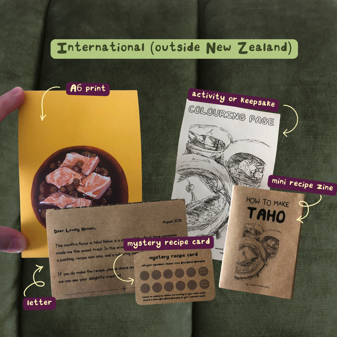 This is an example of snail mail contents including an A6 print with a food photo, a letter, a mini recipe zine, a coloring page, and one mystery recipe card. 